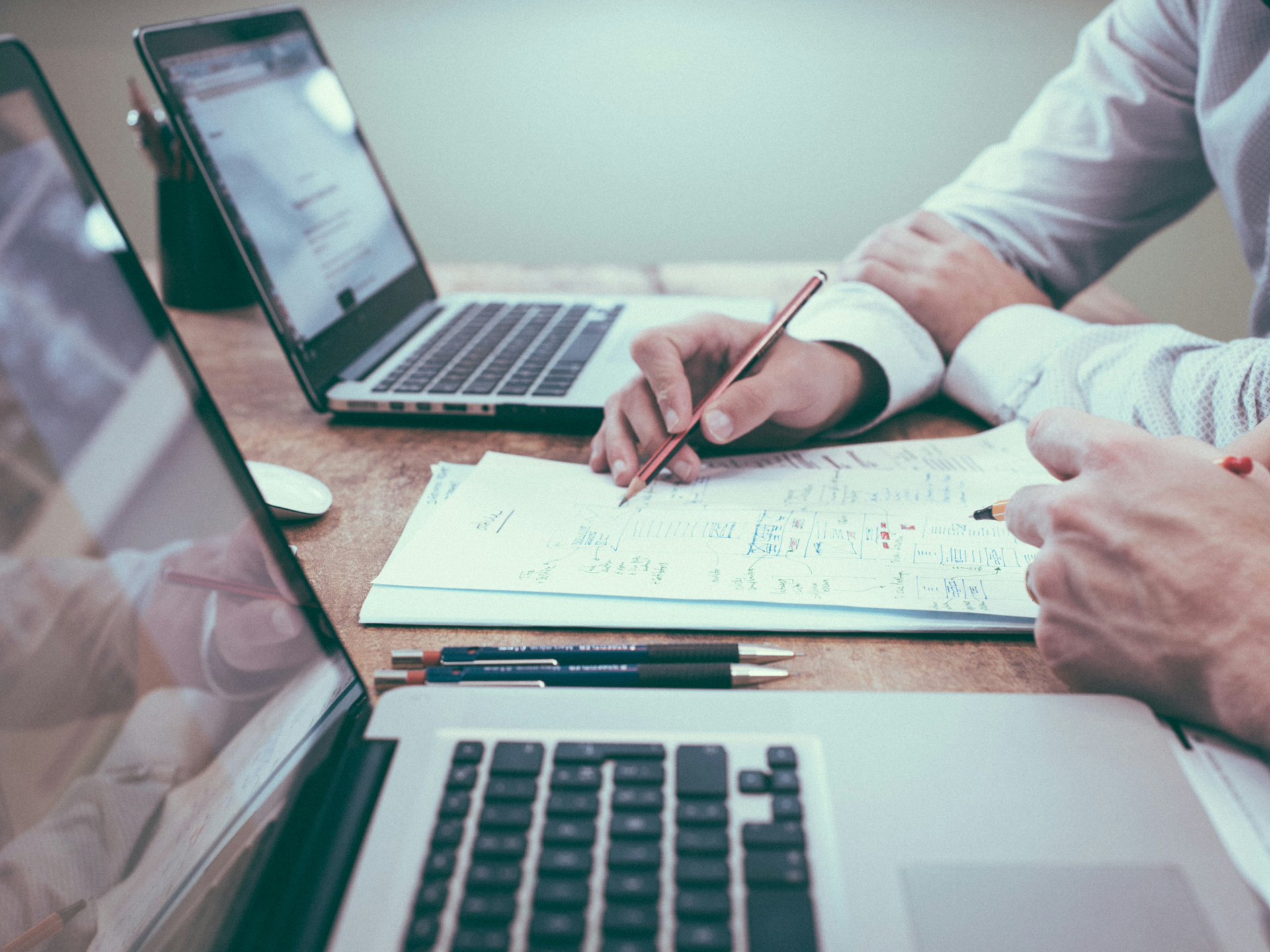 Brainstorming over paper. Photo by Scott Graham on Unsplash.